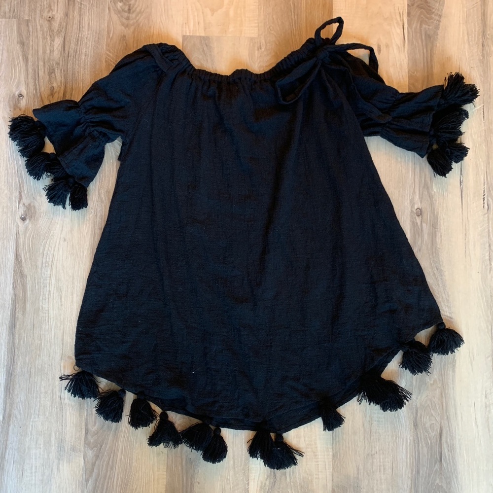 Sleeveless dress with Pom poms